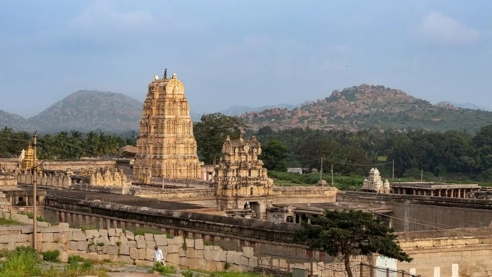 The Virupaksha Temple towers among the boulder hills of Hampi