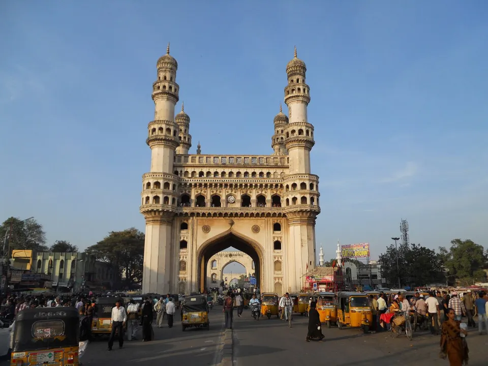 The four minarets of the Charminar in Hyderabad under a blue sky