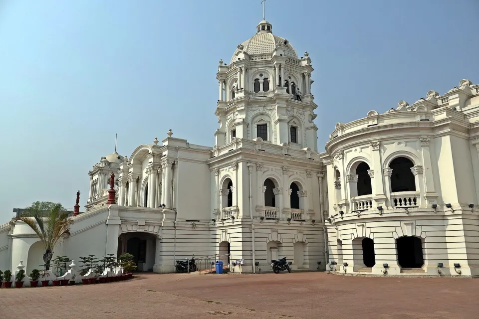 The white Ujjayanta Palace in Agartala under a blue sky